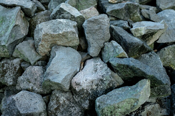 Texture pile of mossy river stones for background