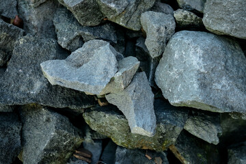 Texture pile of mossy river stones for background