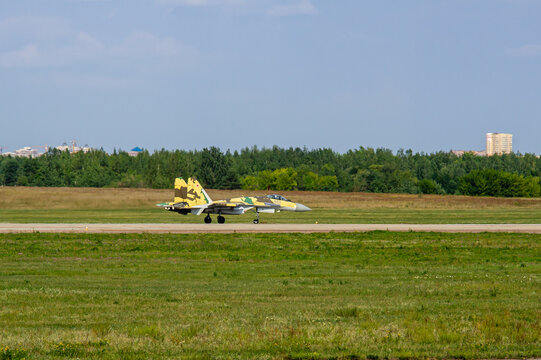 MAKS-2011. Soviet-Russian multi-role fighter Su-35 (NATO - Flanker-E) of four plus generation, plus accelerates along runway for takeoff. Close-up of aircraft. Zhukovsky, Russia - August 16, 2011