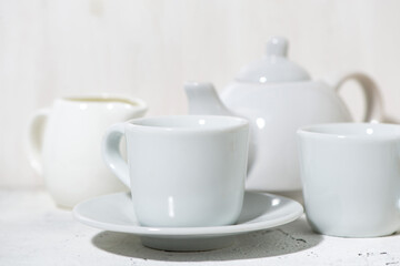 Obraz na płótnie Canvas white utensils for tea drinking closeup