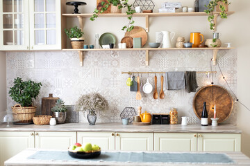 Stylish scandi cuisine interior decor. Ceramic plates, dishes, utensils and cozy decor on wooden shelfs. Kitchen wooden shelves with various ceramic jars and cookware. Open shelves in the kitchen.	