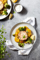 salmon medallions with broccoli and baked potatoes