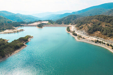 Aoos Springs Lake in the Metsovo in Epirus. mountains of Pindus in northern Greece. Techniti Limni Aoou Lake. Aerial view, top view, drone