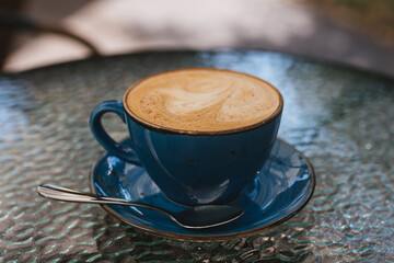 A cup of coffee in a summer cafe