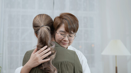 Holiday concept of 4k Resolution. Asian women embracing each other in the house. Young women are in...