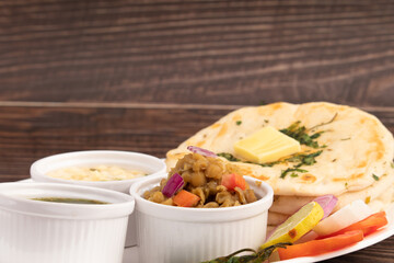 Chole Kulche Also Called Matar Kulcha, Chhole Kulche Is Widely Popular Delhi Street Food. The Dish Comprises Of Mildly Leavened Soft Fluffy Flatbread Made Of Maida And White Peas Or Safed Matar Curry