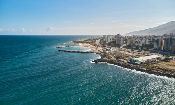 Aerial view picturesque public beach with turquoise water. Los Corales, La Guaira, Venezuela