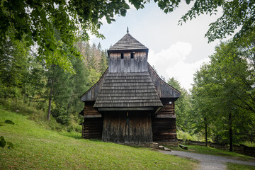Fototapeta na wymiar Gothic wooden church of St. Elizabeth from Zabrez located in the open air museum representing village of Orava region, Zuberec, Slovakia