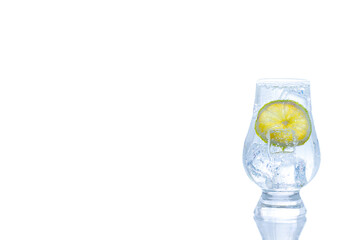 Glass of gin and tonic with ice and lime isolate on white background.