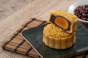 Delicious Cantonese moon cake for Mid-Autumn Festival food mooncake on wooden table background.