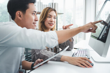 Obraz premium Successful team of new business startup people working together in creative office, happy euphoric proud Asian male and female professional winner feel overjoyed