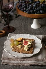 Crostini with ricotta cheese, figs and honey. n white background. Italian recipe menu.