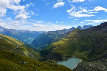 View of mountain ranges in High Tauern mountains with the Stausee Margaritze lake bellow in Carinthia, Asutria