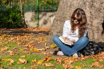 Teenage Students: A Good Book. A teenage girl relaxing with a engaging read. From a series of high...