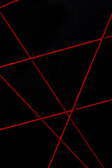 black background with red threads