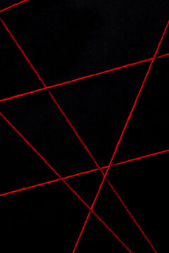 black background with red threads