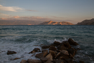 Romantic seascape of the rocky coast of the Mediterranean Sea near Baska, island of Krk, Croatia, at sunset