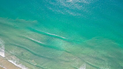 Blue ocean, boats and sandy beach