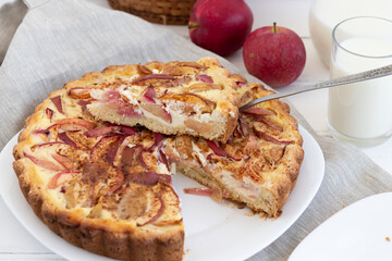 American classic sour cream pie with apples on a white wooden background