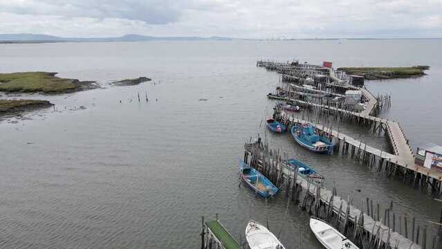 Aerial view of Porto Palafita da Carrasqueira, a beautiful pier made of wood by fishermen renowned for its sunset view, Comporta, Troia Peninsula, Setubal, Portugal.