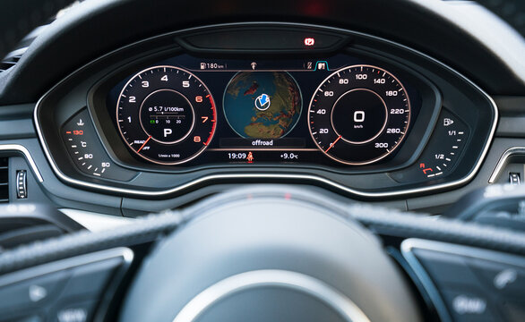 virtual cockpit with a globe on the screen inside luxury car. Car interior and tech concept.