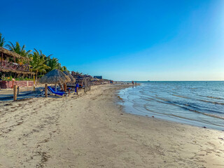 Fototapeta na wymiar Beautiful Holbox island beach sandbank panorama turquoise water people Mexico.