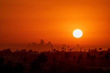 The Sun rises over Los Angeles, California, USA during a dangerous heat wave that has been...