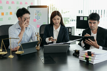 Lawyers sit for a meeting with the team at the law firm.