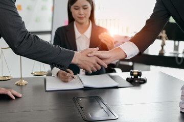 Handshake after good cooperation, Consultation between a male lawyer and businessman customer, tax and the company of real estate concept.