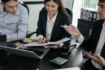 Lawyers sit for a meeting with the team at the law firm.