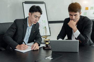 A female lawyer is consulting with a team in the office to resolve the issue Lawyer Fight for Freedom of Her Client with Supporting Evidence