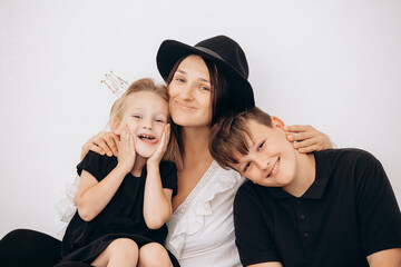 Family mother, daughter and son beautiful and happy together, portrait on white background