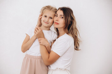 Family mother and daughter, beautiful and happy together, portrait on a white background