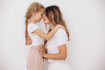 Family mother and daughter, beautiful and happy together, portrait on a white background