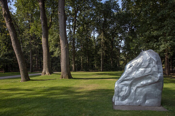 trees in park and sculpture at kroller moller museum, art museum, national park hoge veluwe, gelderland, netherlands, 