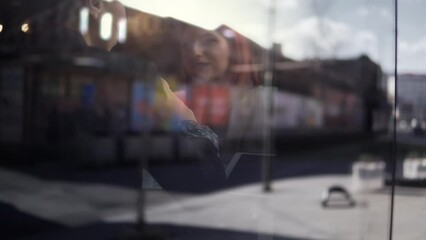 Friendly young confident female colleagues having a pleasant chat at coffee shop during work break, talkative coworker discussing new project, selective focus to womans inside