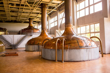 Brewery. Tanks for brewing beer. Industrial work, automated modern food and drink production in...