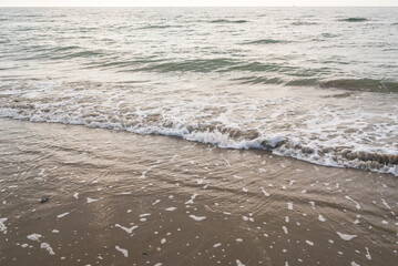 Seashore landscape. Summer holiday destination in Italy. Sandy beach in sunlight.