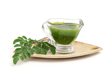 Moringa extracted with water isolated on white background.