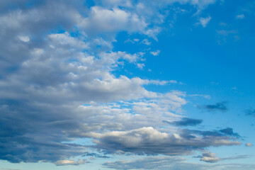 Obraz premium The moon and clouds in the blue evening sky. Natural background photo texture