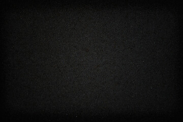 Obraz premium Blank flat surface of gray color. Dark background with fine texture and focus on center. Advertising backdrop for ad. Minimalism in design.