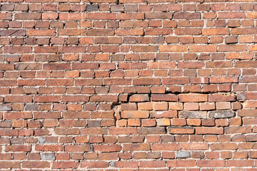 The texture background brick wall made of old red brick