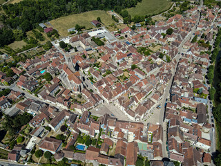 Aerial view above the beautiful french village of Noyers during summer