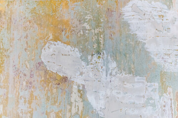 Texture of an old shabby wall with many layers of paint. Multicolored abstract light grunge plaster pattern