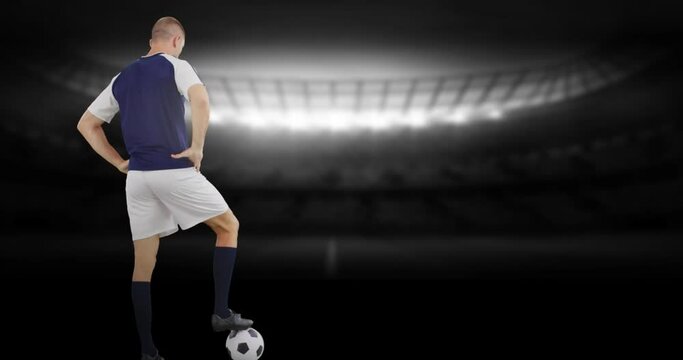 Animation of stadium over caucasian male soccer player