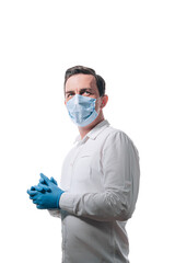 male doctor in a medical mask on his face and gloves on a white background - 529219848