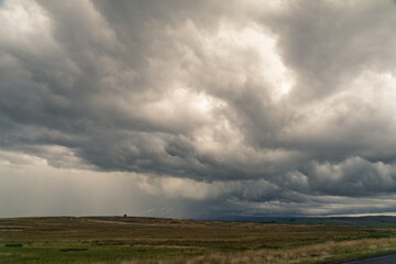 Fototapeta na wymiar Dramatic storm clouds over Northumberland countryside