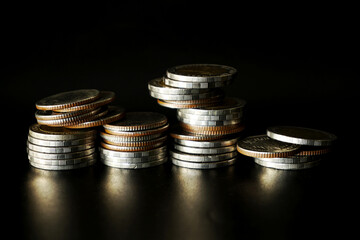 Stack of money coin on black background, Saving money concept