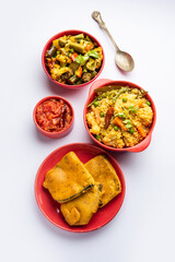 Bengali Bhog food for Indian Hindu Durga Puja or pooja festival. Khichadi, labra, tomato chutney