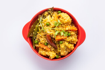 Bengali dish khichdi or khichuri made from a combination of lentils and rice and vegetables